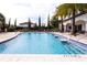 Sparkling community pool with fountains and comfortable seating areas, perfect for relaxation at 8419 Pippen Dr, Orlando, FL 32836