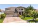 Beautiful two-story home showcasing a three-car garage and a brick-paved driveway at 8419 Pippen Dr, Orlando, FL 32836