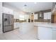 This spacious kitchen showcases stainless steel appliances and a central island, offering room for dining and meal preparation at 8419 Pippen Dr, Orlando, FL 32836