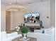Cozy living room featuring modern furniture, decor, and a large flat-screen TV at 8419 Pippen Dr, Orlando, FL 32836