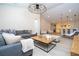 Open concept living area with a large sectional sofa, modern decor, and access to additional living spaces at 8419 Pippen Dr, Orlando, FL 32836