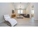 Spacious living room with light wood floors, a comfortable seating area, and a modern entertainment setup at 8419 Pippen Dr, Orlando, FL 32836