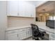 A functional home office featuring built-in cabinets and ample workspace at 8419 Pippen Dr, Orlando, FL 32836
