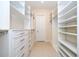 Large walk-in closet with adjustable shelves and drawers, providing customizable storage solutions at 8419 Pippen Dr, Orlando, FL 32836