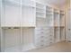 Spacious walk-in closet features custom shelving, drawers, and ample storage space at 8419 Pippen Dr, Orlando, FL 32836