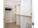Spacious walk-in closet features custom shelving and ample storage space for organization at 8419 Pippen Dr, Orlando, FL 32836