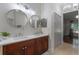 Bathroom featuring a double sink vanity, soaking tub, and modern finishes at 920 Cool Springs Cir, Ocoee, FL 34761