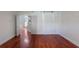 Bright bedroom featuring wood floors, a sliding barn door, and ample natural light at 920 Cool Springs Cir, Ocoee, FL 34761