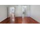 Bright bedroom featuring wood floors, a sliding barn door, and ample natural light at 920 Cool Springs Cir, Ocoee, FL 34761