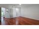 Bright bedroom featuring wood floors, a sliding barn door, and ample natural light at 920 Cool Springs Cir, Ocoee, FL 34761