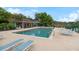 Community pool with chairs and lounge seating at 920 Cool Springs Cir, Ocoee, FL 34761