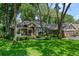 Charming home with lush lawn and mature trees providing shade and curb appeal at 920 Cool Springs Cir, Ocoee, FL 34761