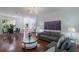 Bright, open-concept living area with hardwood floors and elegant furnishings at 920 Cool Springs Cir, Ocoee, FL 34761