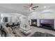 A seamless transition from the kitchen to the living area with modern amenities and a cozy fireplace at 920 Cool Springs Cir, Ocoee, FL 34761