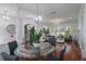 Spacious living area with hardwood floors, dining table, and modern decor at 920 Cool Springs Cir, Ocoee, FL 34761