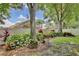 Expansive backyard featuring lush landscaping, mature trees, privacy fence, and manicured lawn at 9521 Southern Garden Cir, Altamonte Springs, FL 32714