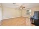 Large bonus room with wood-look floors, ceiling fan, and large window at 9521 Southern Garden Cir, Altamonte Springs, FL 32714