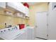Clean laundry room with storage shelves and like new washer and dryer at 9521 Southern Garden Cir, Altamonte Springs, FL 32714