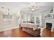 Inviting living room with hardwood floors, a cozy fireplace, and French doors leading to outdoor space at 9521 Southern Garden Cir, Altamonte Springs, FL 32714