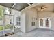 Screened patio with ceiling fan, tiled floors, and access to backyard offers a relaxing outdoor space at 9521 Southern Garden Cir, Altamonte Springs, FL 32714
