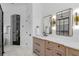 Stylish bathroom with double vanity, modern mirrors, and a shower at 960 Brightwater Cir, Maitland, FL 32751