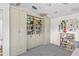 Bedroom featuring custom built-in bookshelves, creating ample storage and display space at 960 Brightwater Cir, Maitland, FL 32751