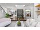 Open-concept living area showcasing hardwood floors, a staircase, and seamless flow to other rooms at 960 Brightwater Cir, Maitland, FL 32751