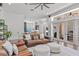 Open-concept living room boasts hardwood floors, modern lighting, and seamless flow to kitchen at 960 Brightwater Cir, Maitland, FL 32751