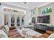 Bright living room with doors leading to a private pool and outdoor space at 960 Brightwater Cir, Maitland, FL 32751