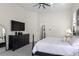 Tranquil main bedroom offers a comfortable king bed and dresser at 960 Brightwater Cir, Maitland, FL 32751