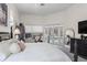Light-filled main bedroom with a king bed, and private outdoor access to the pool at 960 Brightwater Cir, Maitland, FL 32751