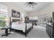Spacious main bedroom features a four-poster bed, natural light, and private outdoor access to the pool at 960 Brightwater Cir, Maitland, FL 32751