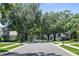Charming street view showcasing mature trees lining the road in a quiet neighborhood at 960 Brightwater Cir, Maitland, FL 32751