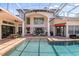 Beautiful pool with screened enclosure and a spacious patio for entertaining guests at 960 Brightwater Cir, Maitland, FL 32751