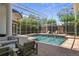 Inviting screened pool area with brick paver deck, lounge chairs and lush greenery at 960 Brightwater Cir, Maitland, FL 32751