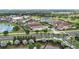 A charming residential area featuring diverse architectural styles near a waterway, showcasing the community's aesthetic appeal at 970 Golden Bear Dr, Reunion, FL 34747