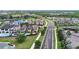Beautiful neighborhood view with a lake and green spaces, showcasing a desirable residential setting at 970 Golden Bear Dr, Reunion, FL 34747