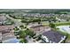 Scenic aerial view of a Primary-planned community featuring lakes, parks, and tree-lined streets at 970 Golden Bear Dr, Reunion, FL 34747