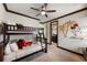 Charming bedroom featuring bunk beds, unique wall decor, and ample natural light at 970 Golden Bear Dr, Reunion, FL 34747