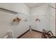 Bright closet with shelving, a fan and dark wood trim at 970 Golden Bear Dr, Reunion, FL 34747