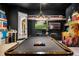 Themed game room with a pool table and unique wall decor at 970 Golden Bear Dr, Reunion, FL 34747