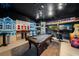 Themed game room with a pool table and unique wall decor at 970 Golden Bear Dr, Reunion, FL 34747