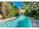 Tranquil lazy river winding through lush tropical vegetation, offering a relaxing and immersive experience at 970 Golden Bear Dr, Reunion, FL 34747