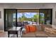 Inviting living room view with a comfortable sofa and a seamless transition to the outdoor patio and pool area at 970 Golden Bear Dr, Reunion, FL 34747