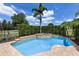 Inviting private pool featuring an attached spa, surrounded by lush landscaping, perfect for relaxation and entertaining at 970 Golden Bear Dr, Reunion, FL 34747