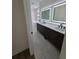 Modern bathroom featuring double sinks, sleek fixtures, a soaking tub, and a glass shower at 1005 Randall St, Orlando, FL 32805