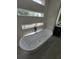 Bright bathroom featuring a modern soaking tub, sleek fixtures, and plenty of natural light at 1005 Randall St, Orlando, FL 32805
