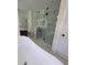 Stylish bathroom featuring a glass enclosed shower and modern soaking tub at 1005 Randall St, Orlando, FL 32805
