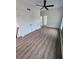 Bedroom with hardwood flooring, a ceiling fan, and spacious closet at 1005 Randall St, Orlando, FL 32805