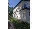 Modern house displays sleek architecture with neutral tones and a neatly kept lawn and landscaping at 1005 Randall St, Orlando, FL 32805